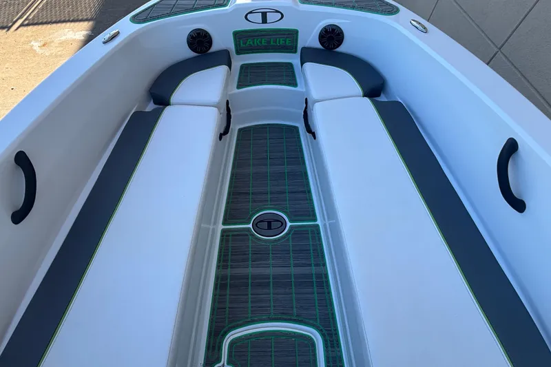 Slide: The Image of 2023 Tahoe T18 boat interior with cushioned seating and stylish flooring design. - 4