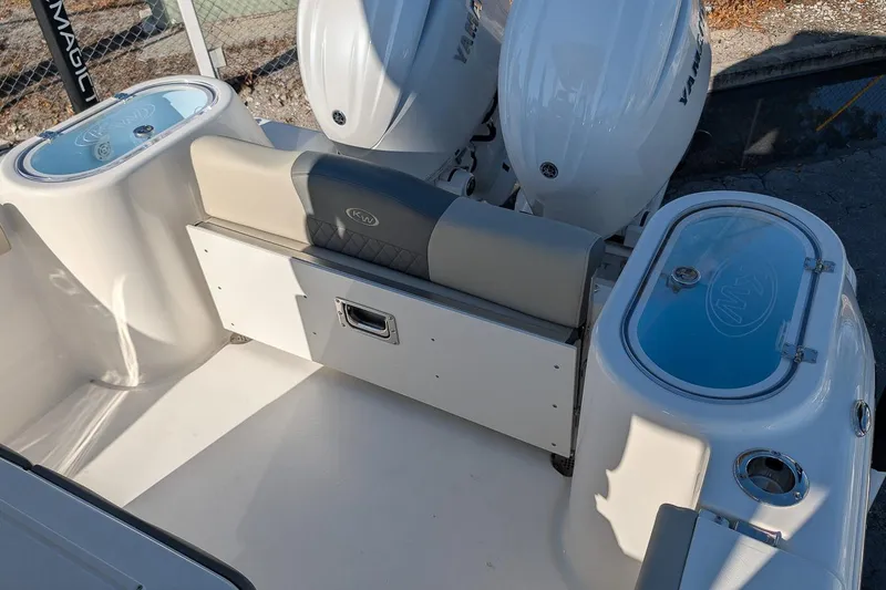 Slide: The Image of 2026 Key West 260 Center Console boat interior with seating and storage compartments. - 11