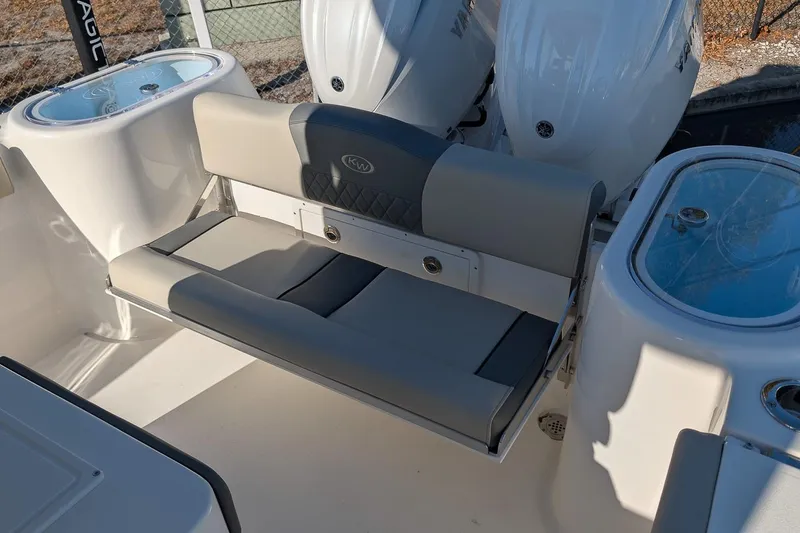 Slide: The Image of 2026 Key West 260 Center Console boat interior with seating and storage compartments. - 12