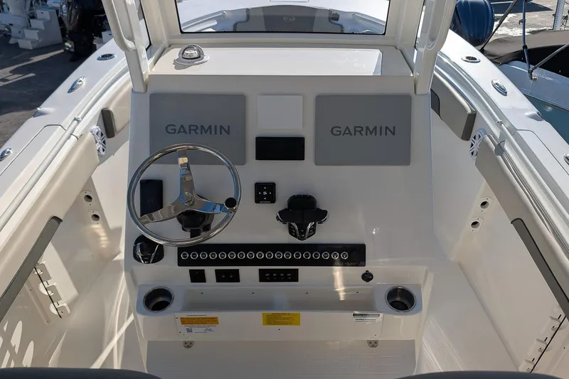 Slide: The Image of 2026 Key West 260 Center Console boat dashboard with Garmin navigation system. - 18