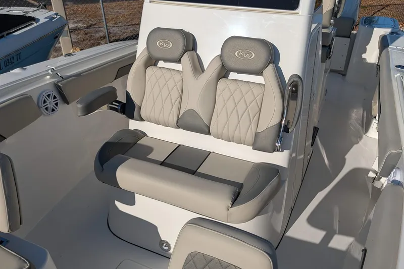 Slide: The Image of 2026 Key West 260 Center Console boat interior with cushioned seating and modern design. - 19