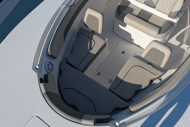 Slide: The Image of 2026 Key West 260 Center Console boat interior with cushioned seating and storage compartments. - 21