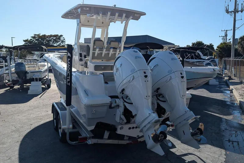 Slide: The Image of 2026 Key West 260 Center Console boat with dual engines on a trailer. - 3