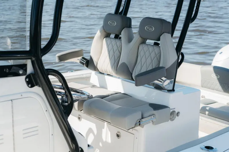 Slide: The Image of Manufacturer Provided Image: 2025 Key West 260 Center Console boat interior with stylish seating and steering wheel. - 30
