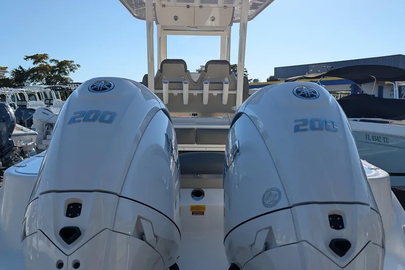 Slide: The Image of 2026 Key West 260 Center Console with dual Yamaha 200 engines, rear view. - 5