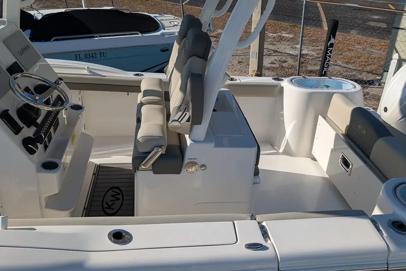 Slide: The Image of 2026 Key West 260 Center Console boat interior with seating and steering wheel. - 6