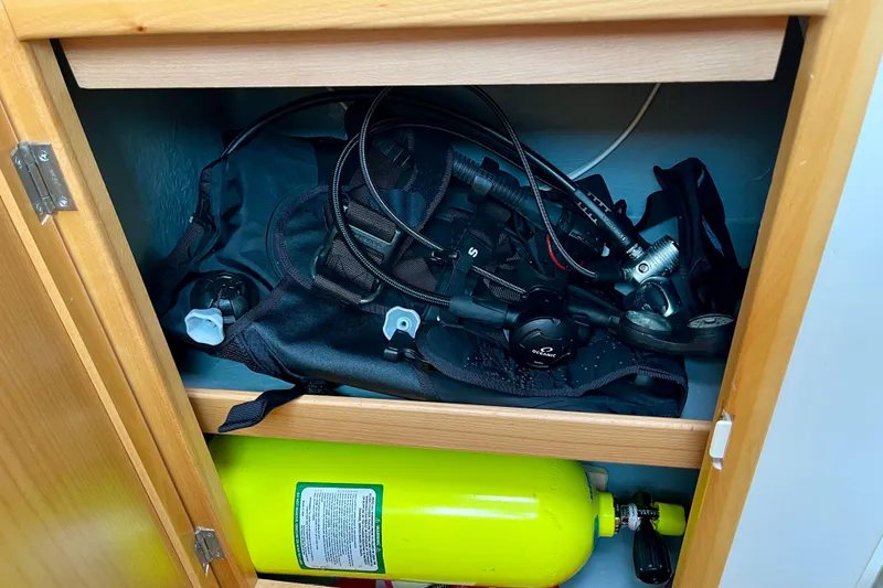 Slide: The Image of Scuba diving gear stored in a Seawind 1160, 2008 model cabinet. - 16