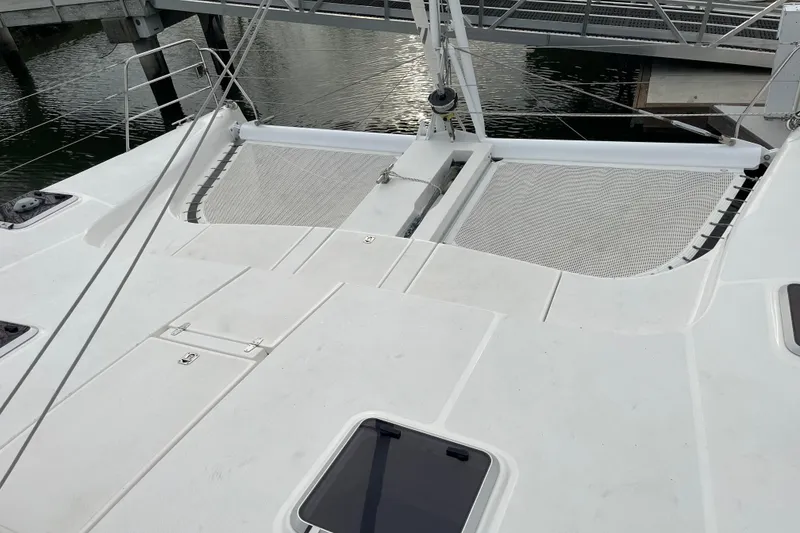 Slide: The Image of 2008 Seawind 1160 catamaran deck with netting, docked at marina. - 3