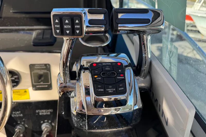 Slide: The Image of Control panel of a 2002 Sport-Craft 3150 Sportfish boat with throttle levers. - 12
