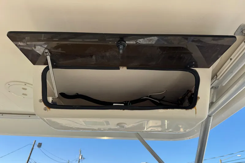 Slide: The Image of Open hatch on 2002 Sport-Craft 3150 Sportfish boat, showing interior wiring. - 13