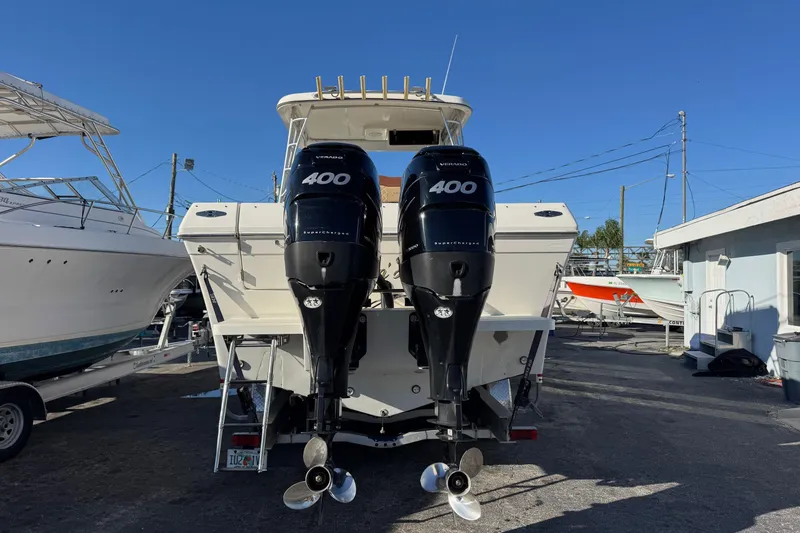 Slide: The Image of 2002 Sport-Craft 3150 Sportfish boat with dual 400 horsepower outboard engines. - 3