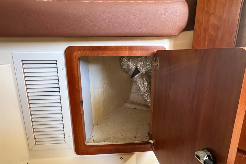 Slide: The Image of Open storage compartment on 2002 Sport-Craft 3150 Sportfish boat interior. - 31