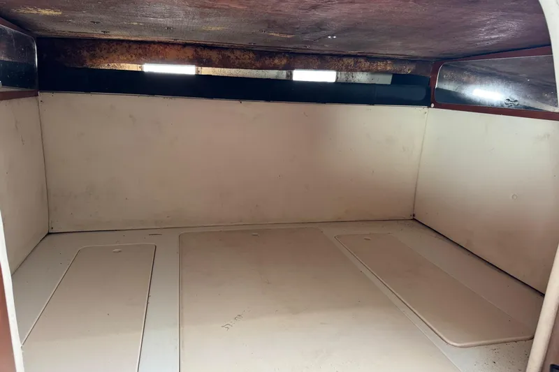 Slide: The Image of 2002 Sport-Craft 3150 Sportfish interior cabin with storage compartments. - 41