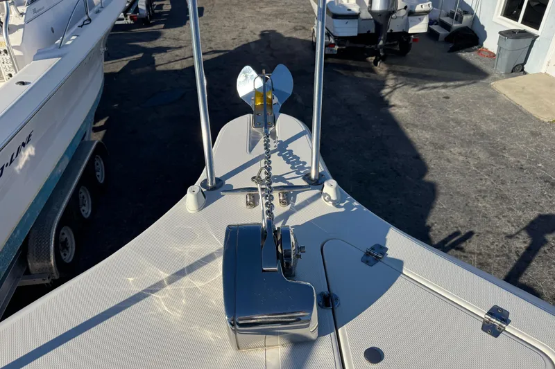 Slide: The Image of 2002 Sport-Craft 3150 Sportfish boat bow with anchor and chain mechanism. - 42