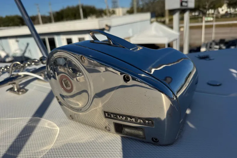 Slide: The Image of Lewmar windlass on 2002 Sport-Craft 3150 Sportfish boat deck, reflecting sunlight. - 43