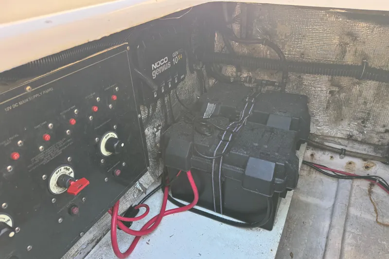 Slide: The Image of Electrical panel and battery setup in a 2002 Sport-Craft 3150 Sportfish boat. - 50