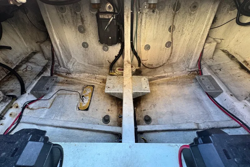 Slide: The Image of 2002 Sport-Craft 3150 Sportfish boat interior, showing engine compartment and wiring. - 52