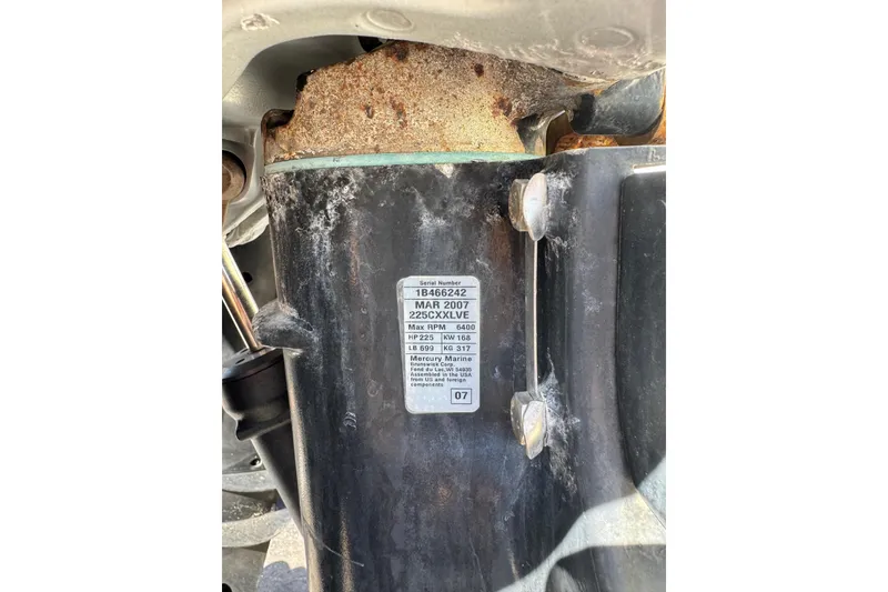 Slide: The Image of Close-up of a 2002 Sport-Craft 3150 Sportfish engine component with a visible label. - 60