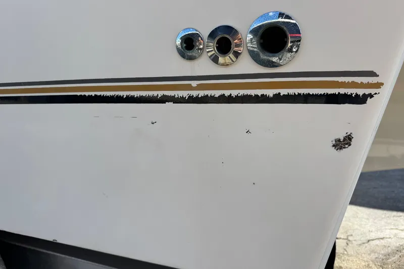 Slide: The Image of 2002 Sport-Craft 3150 Sportfish boat hull with scratches and chrome fittings. - 63