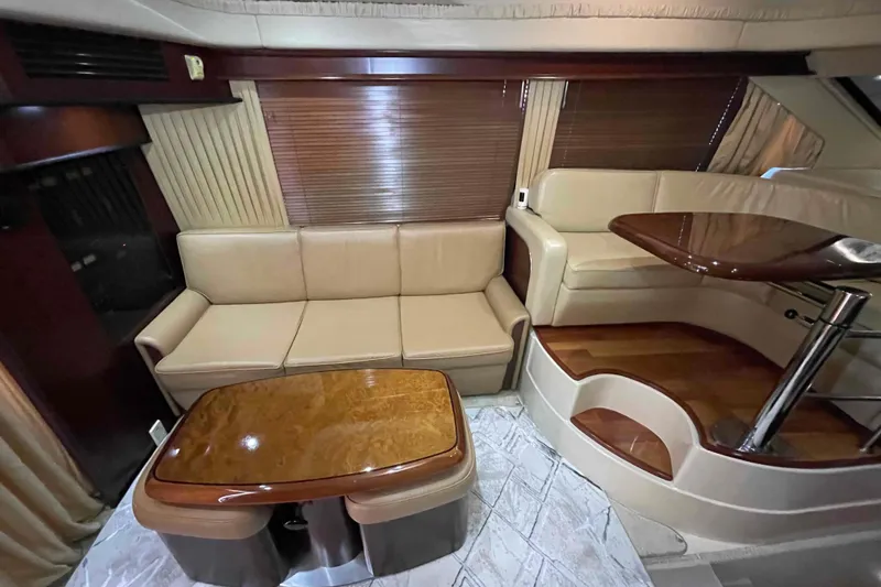 Slide: The Image of Beige leather sofa in 2005 Sea Ray 420 Sedan Bridge yacht interior. - 17