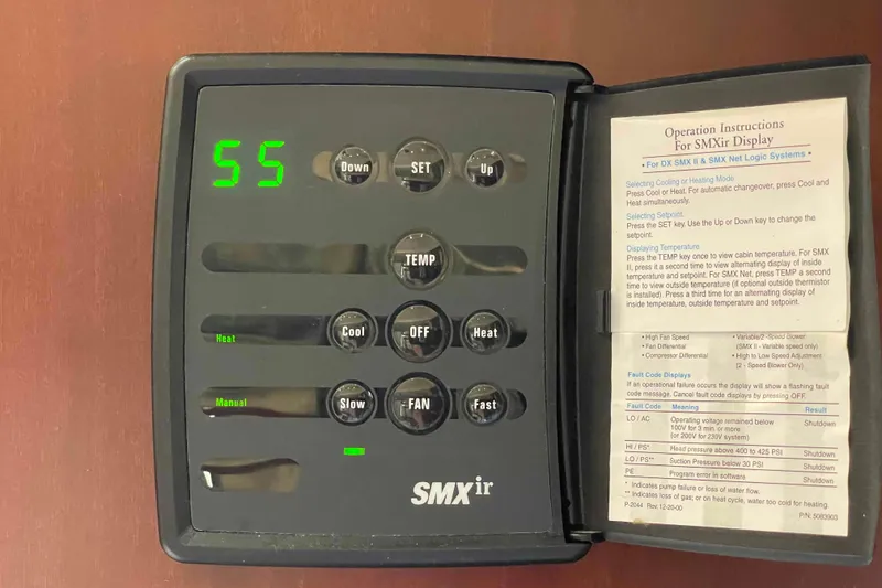 Slide: The Image of Luxurious interior of 2005 Sea Ray 420 Sedan Bridge with beige seating and wooden accents. - 18