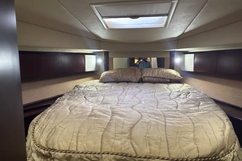 Slide: The Image of Luxurious interior of 2005 Sea Ray 420 Sedan Bridge with elegant seating and modern kitchen. - 23