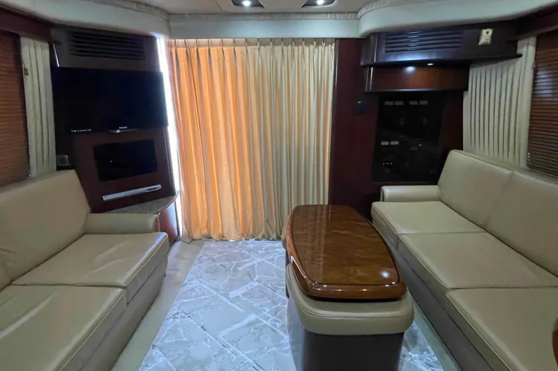 Slide: The Image of 2005 Sea Ray 420 Sedan Bridge cabin with cozy bedding and ambient lighting. - 28