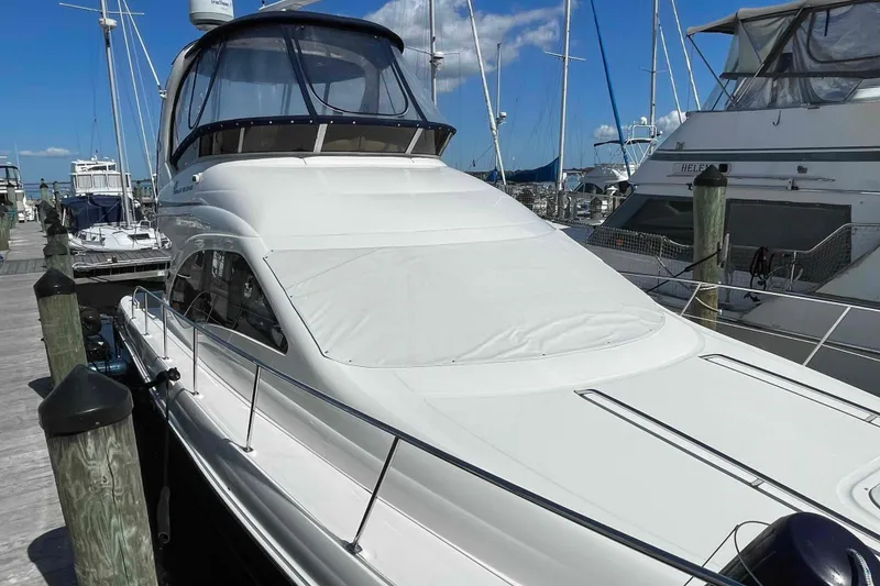 Slide: The Image of Luxurious interior of 2005 Sea Ray 420 Sedan Bridge yacht with elegant seating and modern design. - 3
