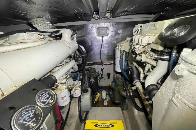 Slide: The Image of Engine room wiring and hoses in a 2005 Sea Ray 420 Sedan Bridge yacht. - 48