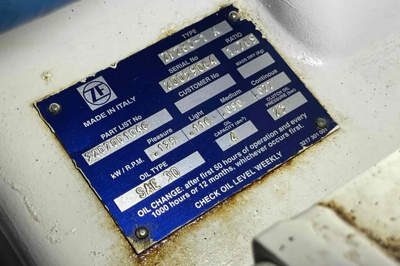 Slide: The Image of Engine room of 2005 Sea Ray 420 Sedan Bridge with batteries and wiring. - 49