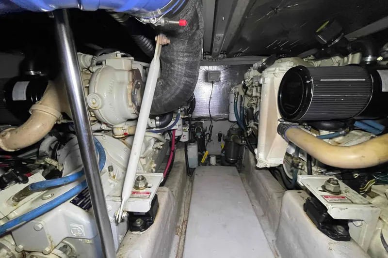 Slide: The Image of Engine compartment of 2005 Sea Ray 420 Sedan Bridge with visible mechanical components. - 52