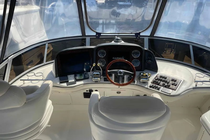 Slide: The Image of Engine room of a 2005 Sea Ray 420 Sedan Bridge, showcasing mechanical components. - 61