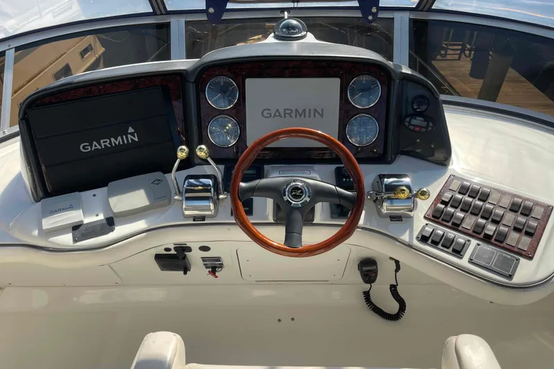 Slide: The Image of Engine room of 2005 Sea Ray 420 Sedan Bridge, showcasing mechanical components and filters. - 62