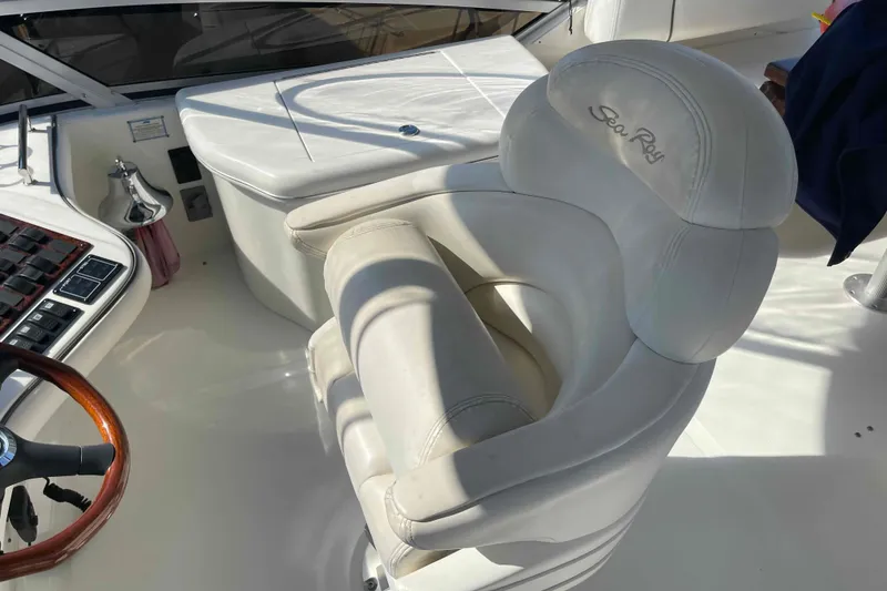 Slide: The Image of Control panel of a 2005 Sea Ray 420 Sedan Bridge, featuring bow thruster and navigation controls. - 78