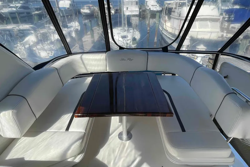 Slide: The Image of Helm of 2005 Sea Ray 420 Sedan Bridge with Garmin navigation system and wooden steering wheel. - 80