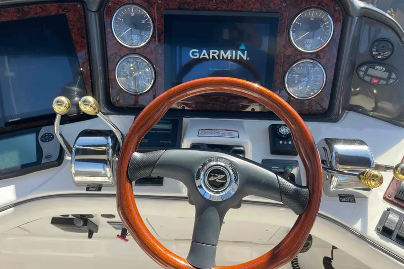 Slide: The Image of Close-up of 2005 Sea Ray 420 Sedan Bridge throttle and bow thruster controls. - 82