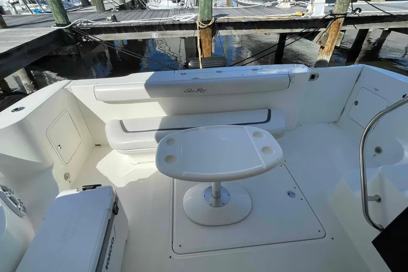 Slide: The Image of Luxurious seating area on 2005 Sea Ray 420 Sedan Bridge yacht with marina view. - 90
