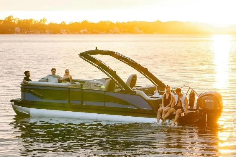Slide: The Image of Manufacturer Provided Image: 2026 Barletta Corsa 23U pontoon boat on a serene lake at sunset. - 9