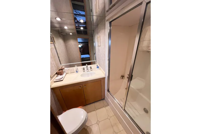 Slide: The Image of Bathroom interior of 2001 Hatteras 75 Cockpit Motor Yacht with shower and vanity. - 23