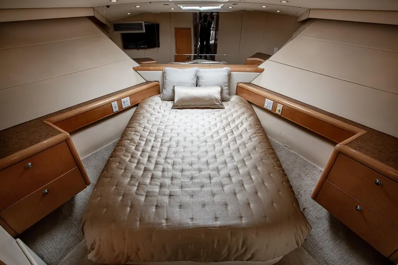 Slide: The Image of Luxurious bedroom interior of 2001 Hatteras 75 Cockpit Motor Yacht with elegant bedding. - 24