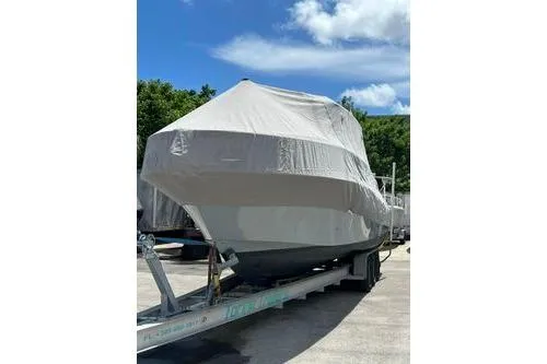 Slide: The Image of 2006 Hydra-Sports Vector 3300 VX boat with triple 250 horsepower engines in a residential driveway. - 2