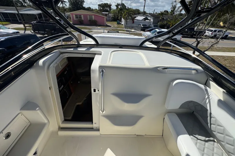 Slide: The Image of 2006 Hydra-Sports Vector 3300 VX boat interior with seating and cabin entrance. - 23