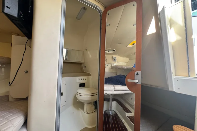 Slide: The Image of 2006 Hydra-Sports Vector 3300 VX cabin interior with bathroom and seating area. - 28
