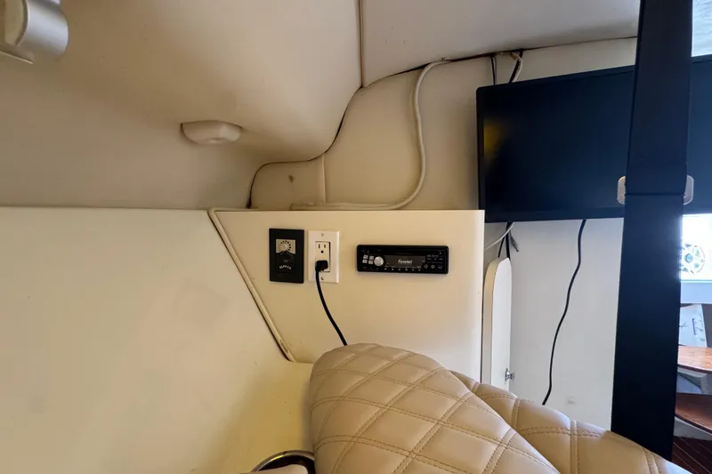 Slide: The Image of 2006 Hydra-Sports Vector 3300 VX cabin interior with TV, outlets, and stereo system. - 32