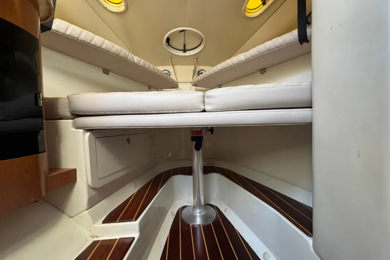 Slide: The Image of Interior cabin of 2006 Hydra-Sports Vector 3300 VX with cushioned seating and wood flooring. - 33
