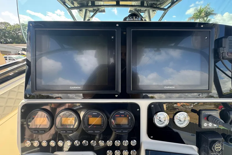 Slide: The Image of 2006 Hydra-Sports Vector 3300 VX dashboard with Garmin displays and Yamaha gauges. - 34