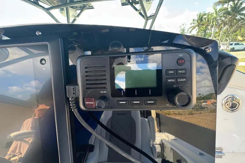 Slide: The Image of Garmin marine radio on 2006 Hydra-Sports Vector 3300 VX boat dashboard. - 37
