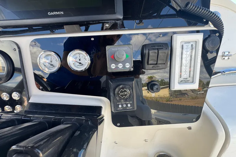 Slide: The Image of 2006 Hydra-Sports Vector 3300 VX dashboard with Garmin display and fuel gauges. - 38