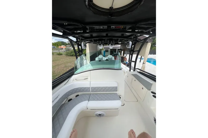 Slide: The Image of 2006 Hydra-Sports Vector 3300 VX boat covered on trailer, outdoors under blue sky. - 4