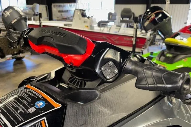 Slide: The Image of 2021 Sea-Doo RXT-X 300 handlebars in a showroom, showcasing control features. - 10